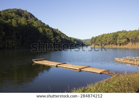 Bamboo raft floating in the lake in natural atmosphere