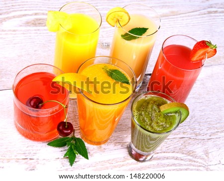 Fruit juices, kiwi, cherry, orange, strawberry, pineapple, top view