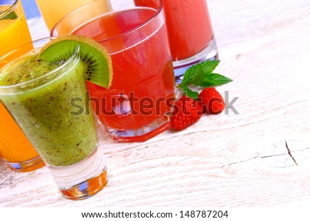 Juices, kiwi, raspberries, cherry, orange, strawberry, close up
