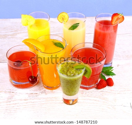 Fruit juices, kiwi, raspberries, cherry, orange, strawberry, pineapple, top view