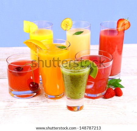 Fruit juices, kiwi, raspberries, cherry, orange, strawberry and pineapple, horizontal