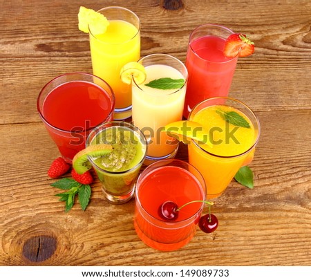 Juices from kiwi, raspberries, cherry, orange, strawberry and pineapple, top view