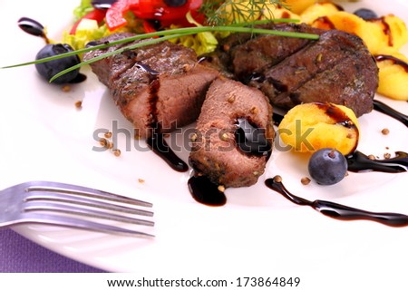 Lamb steak with potato, vegetable and balsamic sauce, close up