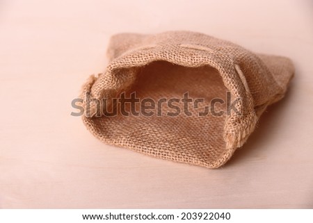 Empty jute sack on wood background, horizontal