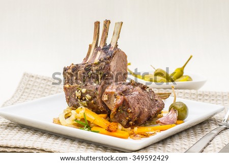 Grilled rack of lamb with carrot onion, garlic and rosemary