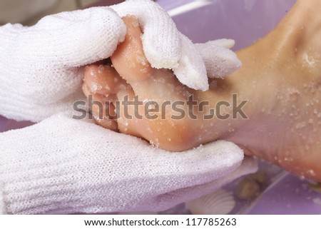 Foot massage in the spa salon