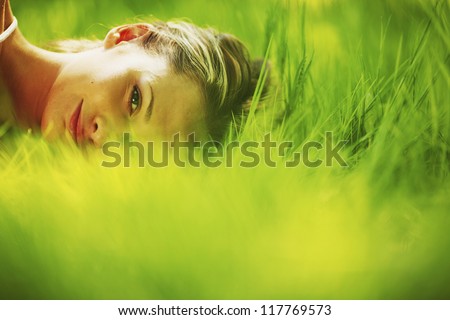 woman sleep on green grass woman sleep on green grass