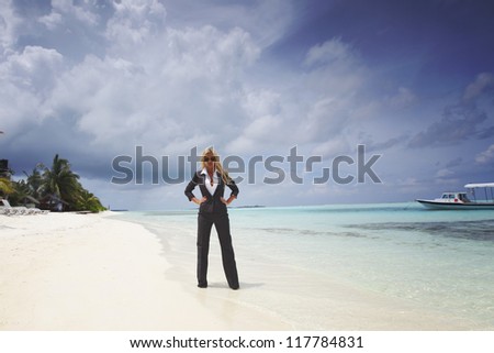 happy  business woman on the desolate ocean coast