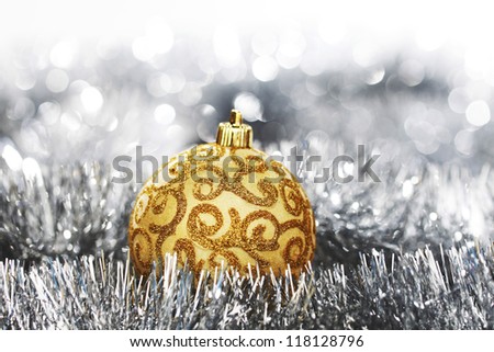 golden christmas ball on silver background