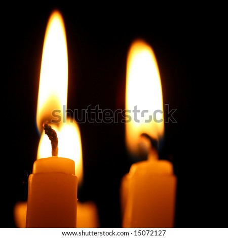 sacred candles in dark