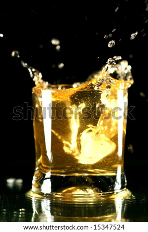 whiskey splash on black background