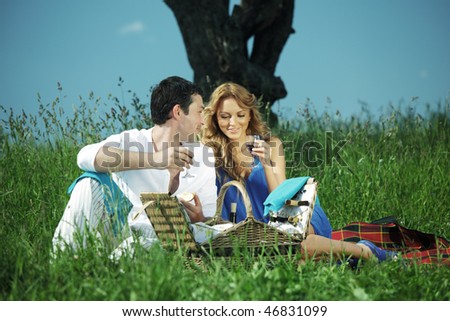 man and woman on picnic