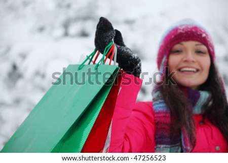 winter girl with gift bags