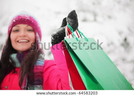 winter girl with gift bags