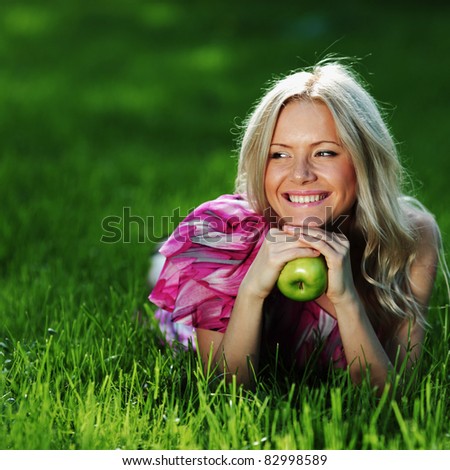 blonde holding an apple