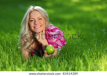 blonde holding an apple
