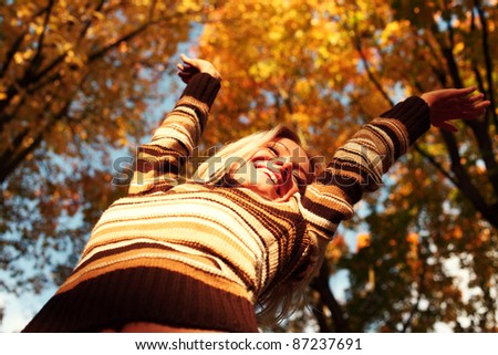 autumn woman on leafs in park