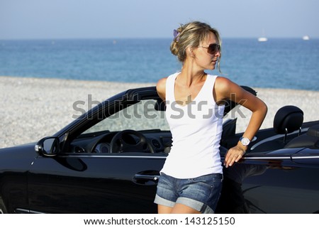 woman near car sea on background