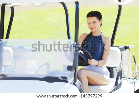 woman in golf car
