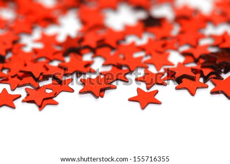 Red christmas stars confetti isolated on white background