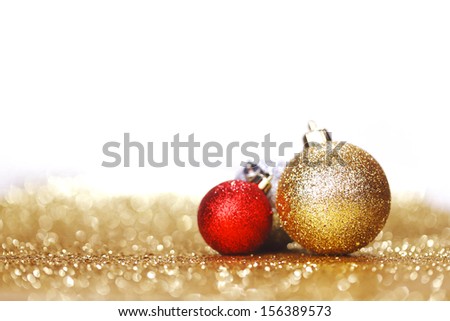 Closeup of Christmas balls on shiny golden background
