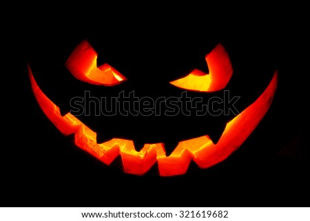 Funny Halloween Jack O\' Lantern pumpkin smile isolated on black background