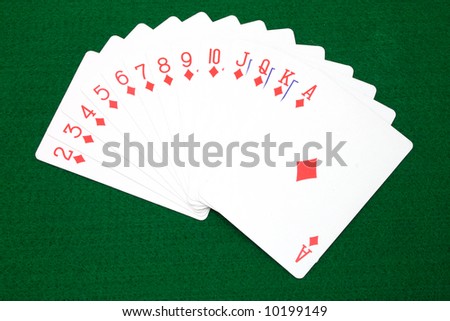 full set of diamond cards over a green surface