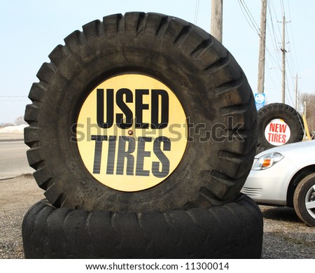 use tires sign and new tires sign on the background
