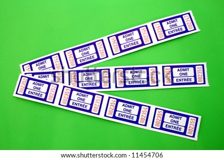 three lines of blue admit one tickets over a green surface