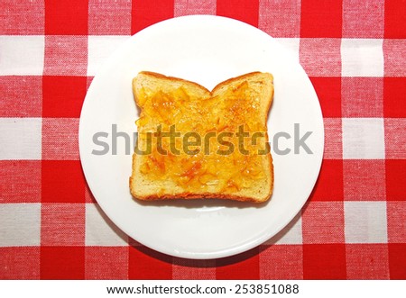Piece of orange marmalade toast