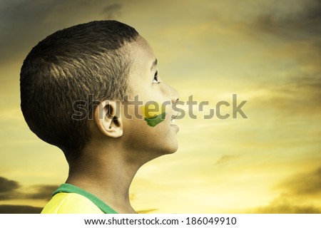 Brazilian little boy looks to the beautiful sky