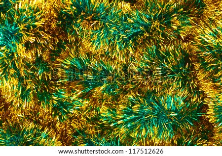 Bright fluffy festive garland green-gold color