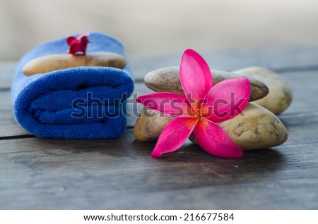 frangipani flower and Fabric with stone, concept of spa, treatment, relaxation and nature