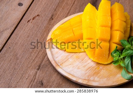mango slice on wood background
