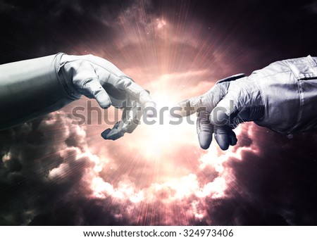 Michelangelo God\'s touch. Close up of human hands touching with fingers in space. Elements of this image furnished by NASA