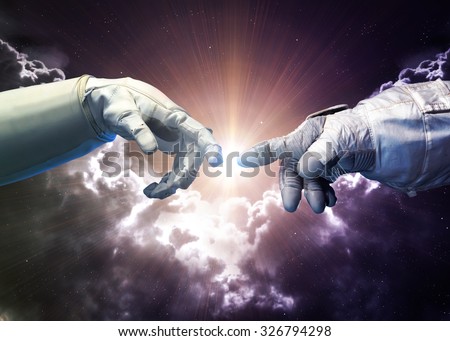 Michelangelo God\'s touch. Close up of human hands touching with fingers in space. Elements of this image furnished by NASA