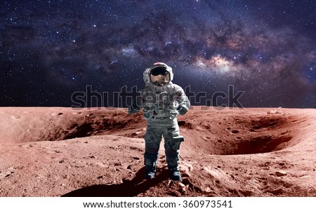 Brave astronaut at the spacewalk on the mars. This image elements furnished by NASA.