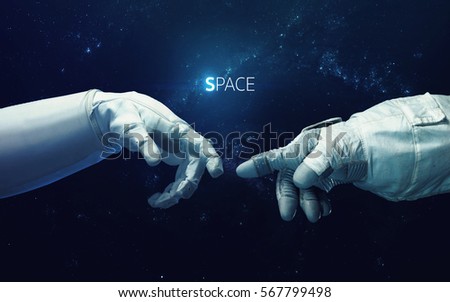 Michelangelo God's touch. Close up of human hands touching with fingers in space. Elements of this image furnished by NASA