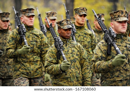 Bucharest, Romania - November 29, 2013: American soldiers march during the rehearsal for the Romania\'s National Day military parade on November 29, 2013 in Bucharest.