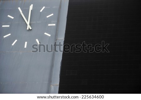 Detail with a traditional sports scoreboard with clock