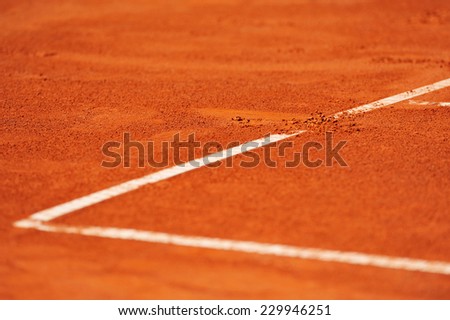 Detail with a baseline footprint on a tennis clay court