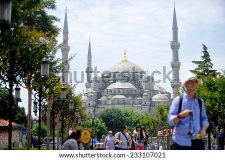 ISTANBUL, TURKEY - JUNE 18: Tourists walking around Istanbul\'s Sultanahmet Mosque also known as Blue Mosque, on June 18, 2014 in Turkey.