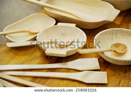 Wooden spoon and other wooden kitchen handmade tools on a table