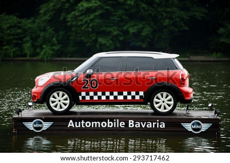 BUCHAREST/ROMANIA - JUNE 26: Advertising campaign with a Mini Cooper floating on a platform on a lake, on June 26, 2015 in Bucharest.