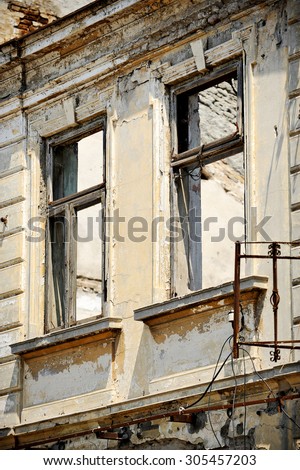 Architecture shot with the facade of a house in ruins