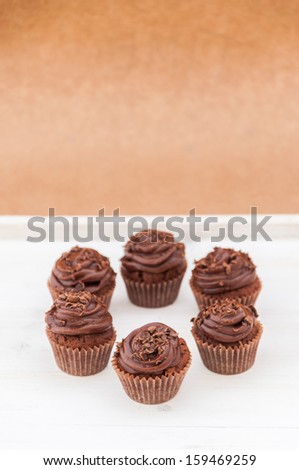Mini cupcakes with dark and milk chocolate frosting and chocolate crumbs on top