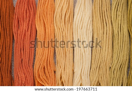 Colorful Threads Set. Natural Linen Background.