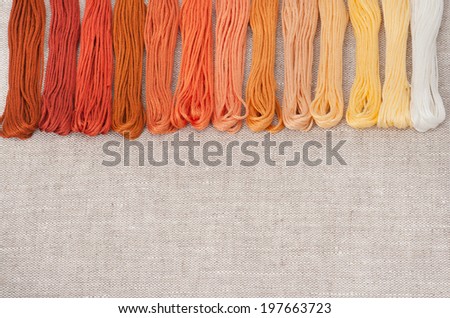 Colorful Threads Set. Natural Linen Background.