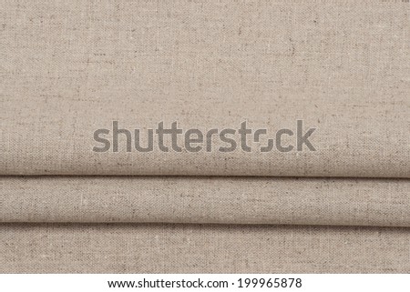 Folded Natural Linen Textile. Background With Copy Space