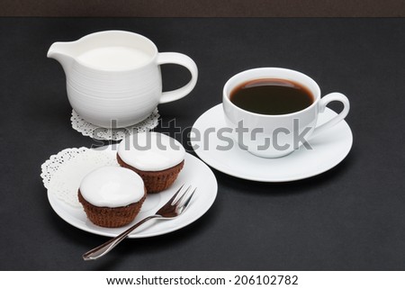 Cupcakes With Cocoa And White Cream. Coffee And Milk.